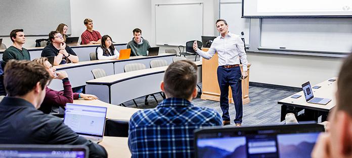 professor giving lecture in a classroom